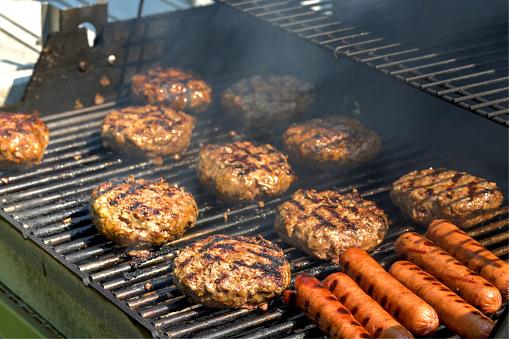 Hamburgers and hot dogs on a grill for Rally lunch