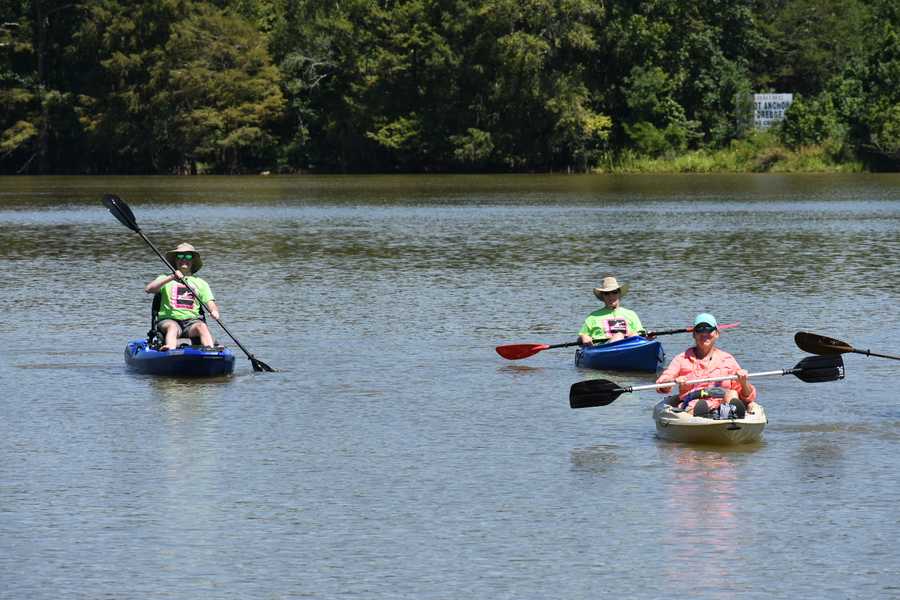 three kayakers approaching by Tara Nicole Bryant