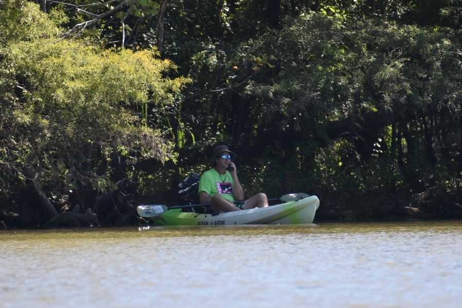 kayaker on phone by Tara Nicole Bryant