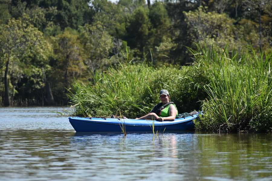 kayaker parked in the reeds by Tara Nicole Bryant