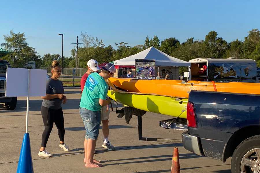 unloading kayaks by John Stafford