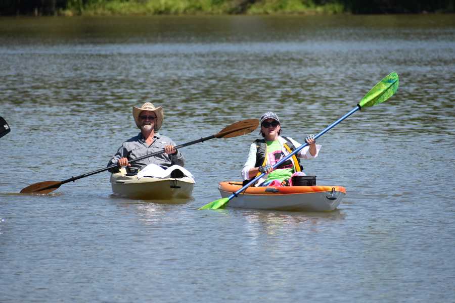 two kayakers paddling by Tara Nicole Bryant